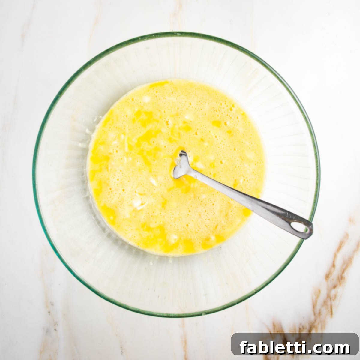 Eggs whisked with shredded onions.