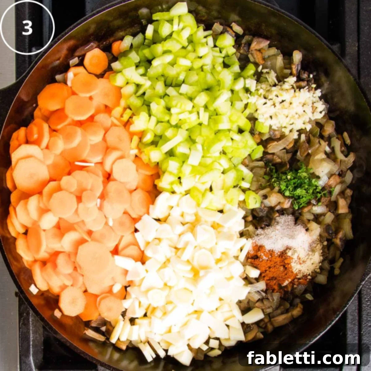 Sun-Kissed Vegan Shepherd's Pie 13 Sections of chopped carrots, parsnips, celery, sauteed onions and mushrooms, plus spices and herbs in a cast iron skillet.