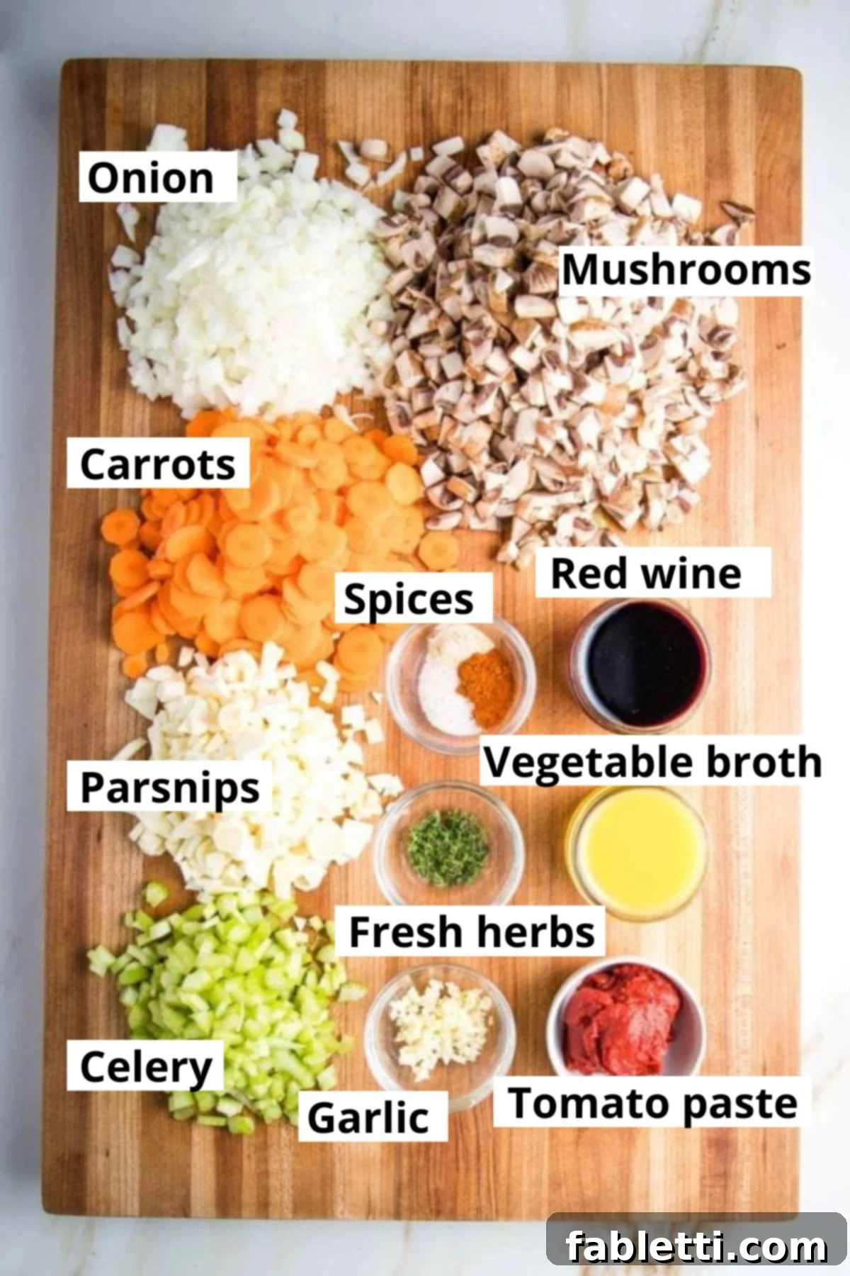 Sun-Kissed Vegan Shepherd's Pie 4 Labeled ingredients: onion, mushroom, carrots, parsnips, celery, vegetable broth, tomato paste, red wine, spices, garlic.