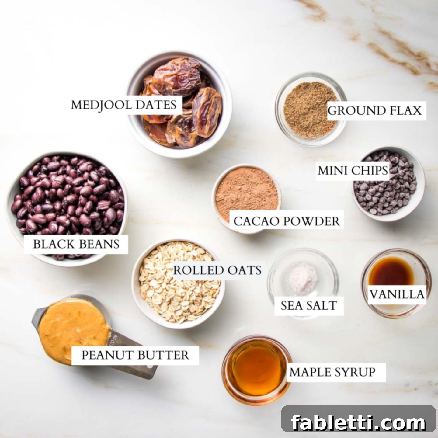 Irresistible Cookie Dough Poppers 3 Images of small bowls of ingredients that are labeled: black beans, medjool dates, ground flax, cacao powder, rolled oats, peanut butter, maple syrup, mini chocolate chips, vanilla and sea salt