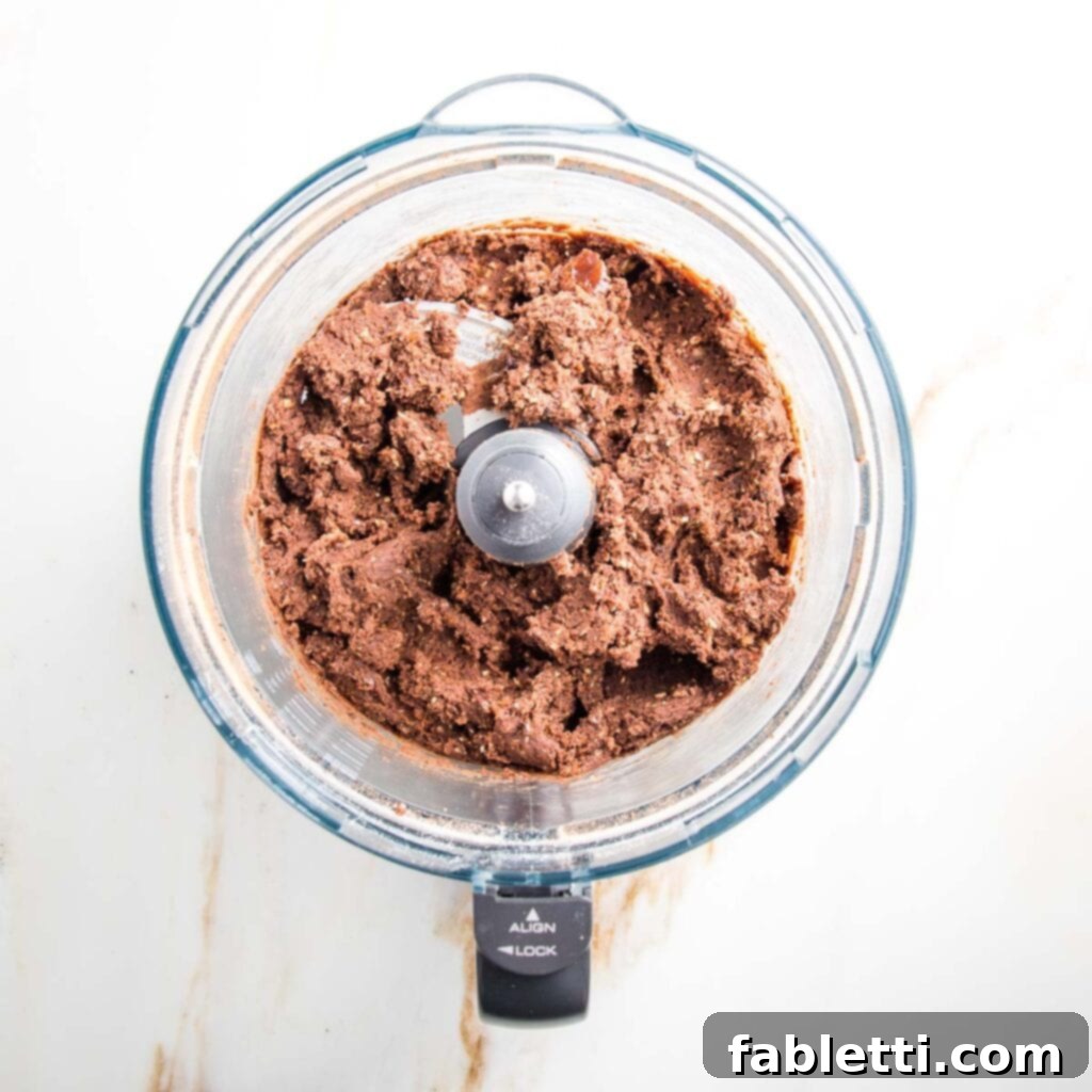 Irresistible Cookie Dough Poppers 7 Food processor bowl filled with chocolate cookie dough