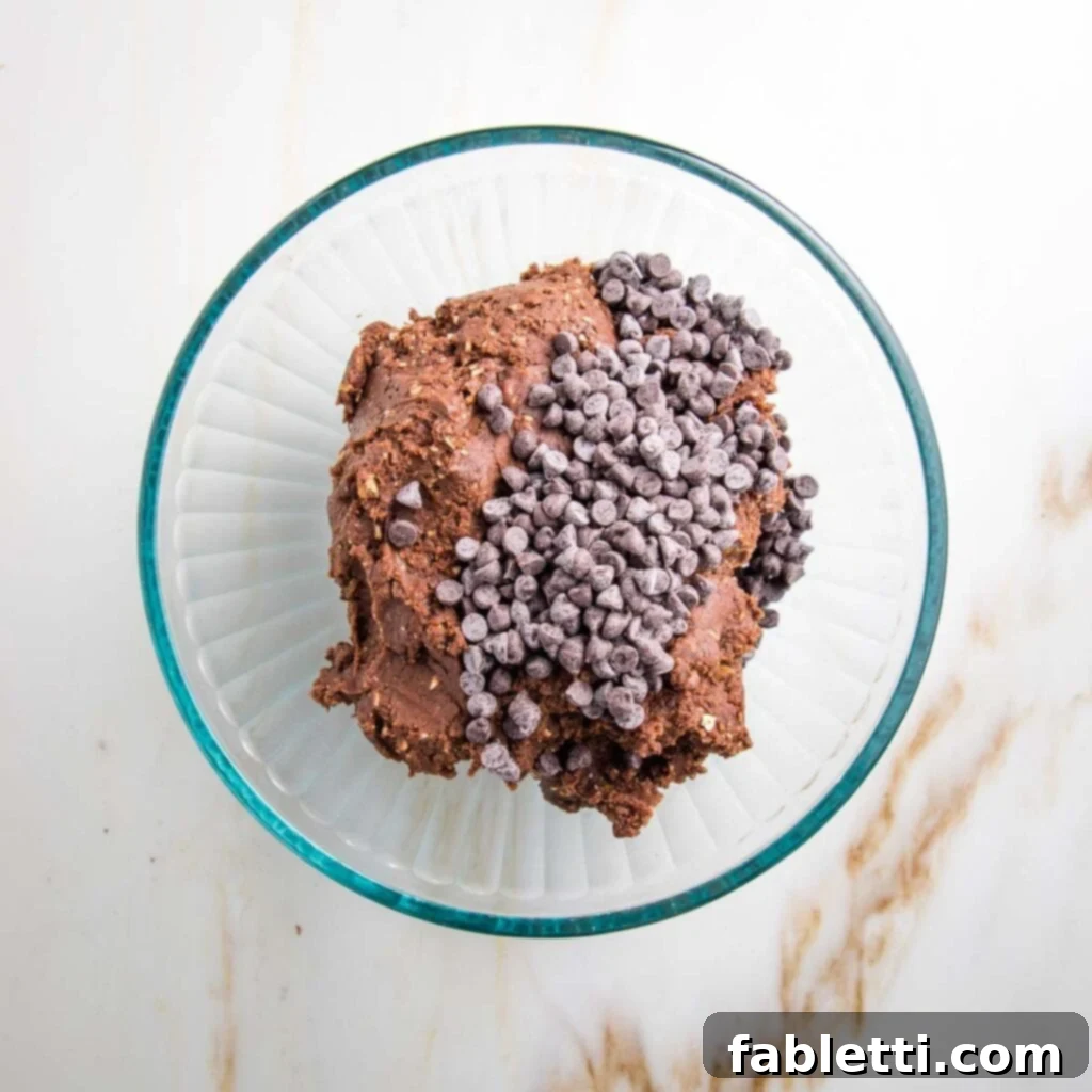 Irresistible Cookie Dough Poppers 9 Glass bowl with chocolate cookie dough and mini chocolate chips