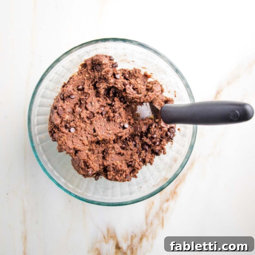 Irresistible Cookie Dough Poppers 10 Glass bowl filled with double chocolate cookie dough.