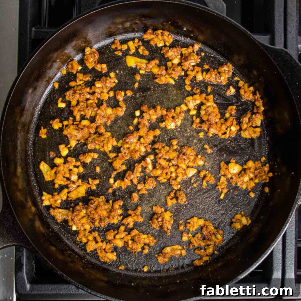 Crispy Baked Samosas with Zesty Cilantro Chutney 4 Onions, garlic and spices sauteed in a cast iron skillet