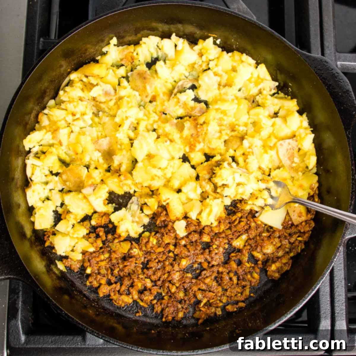 Crispy Baked Samosas with Zesty Cilantro Chutney 5 Cast iron skillet half filled with onion/garlic/spice mixture and the other half has diced boiled potatoes