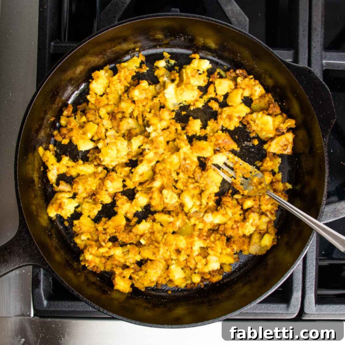 Crispy Baked Samosas with Zesty Cilantro Chutney 6 Cast iron skillet filled with potatoes, onions, garlic and spices that have been sauteed.