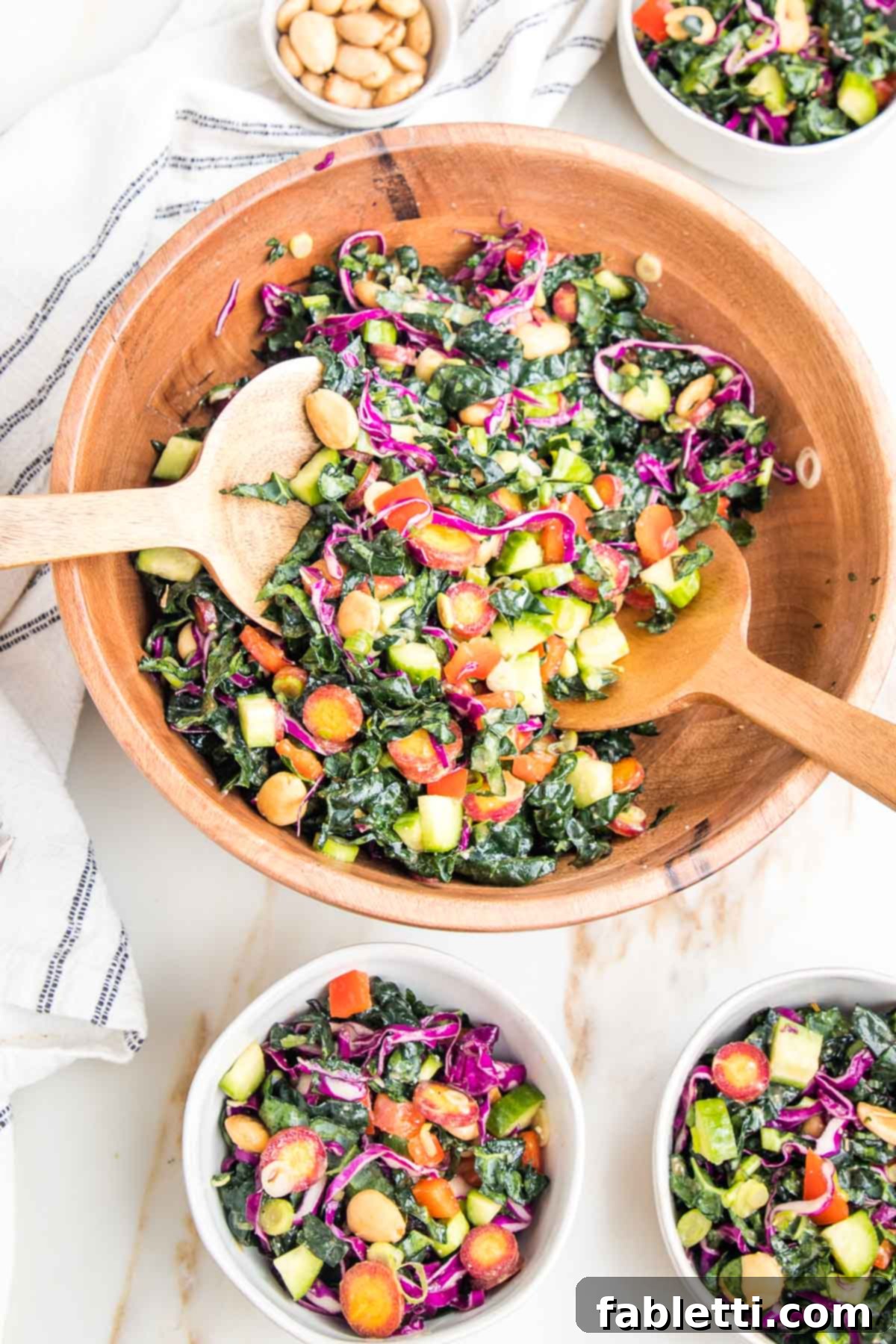 Rustic Tuscan Chopped Kale Medley 2 Colorful chopped kale salad in a wooden bowl. 3 small salad bowls filled with same salad.