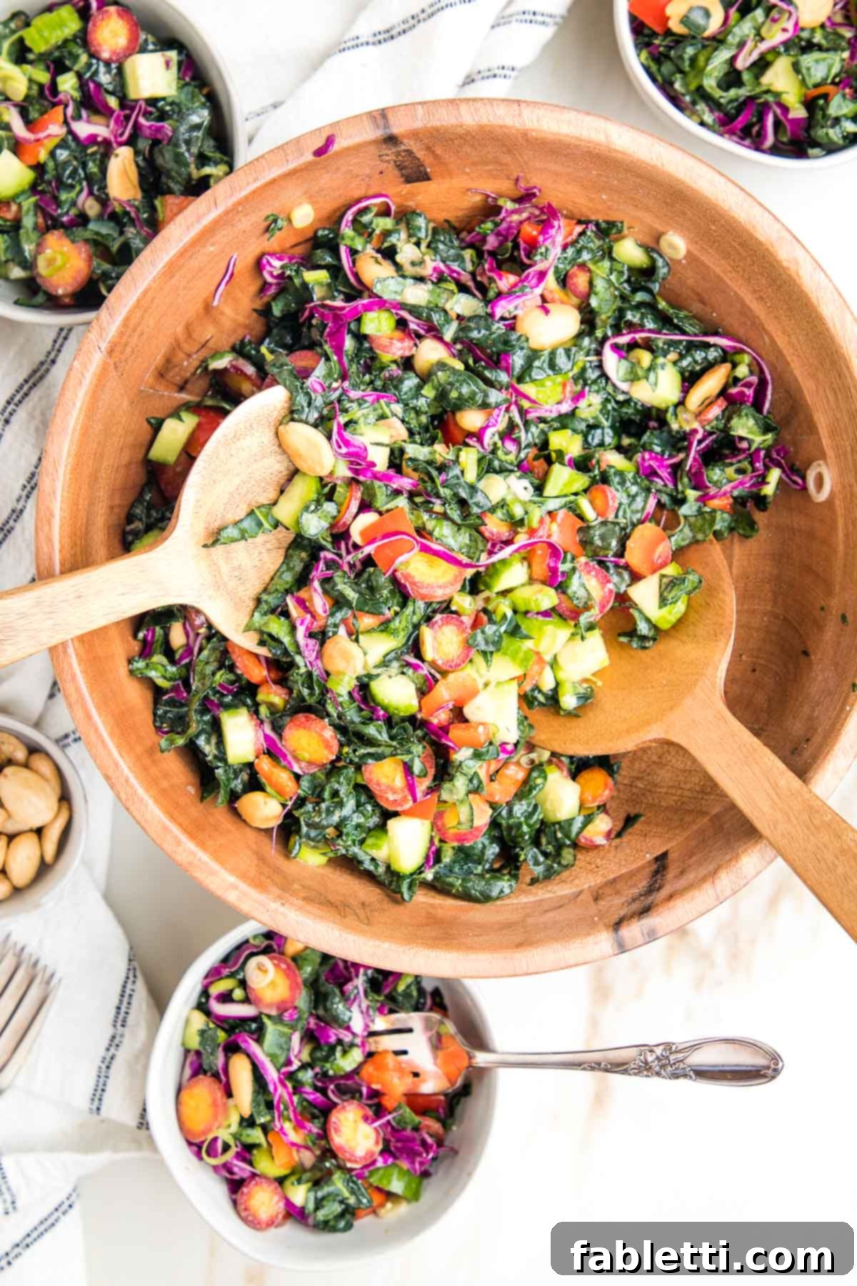 Rustic Tuscan Chopped Kale Medley 12 Colorful chopped kale sale in a wooden bowl, along with small bowls filled with same salad.