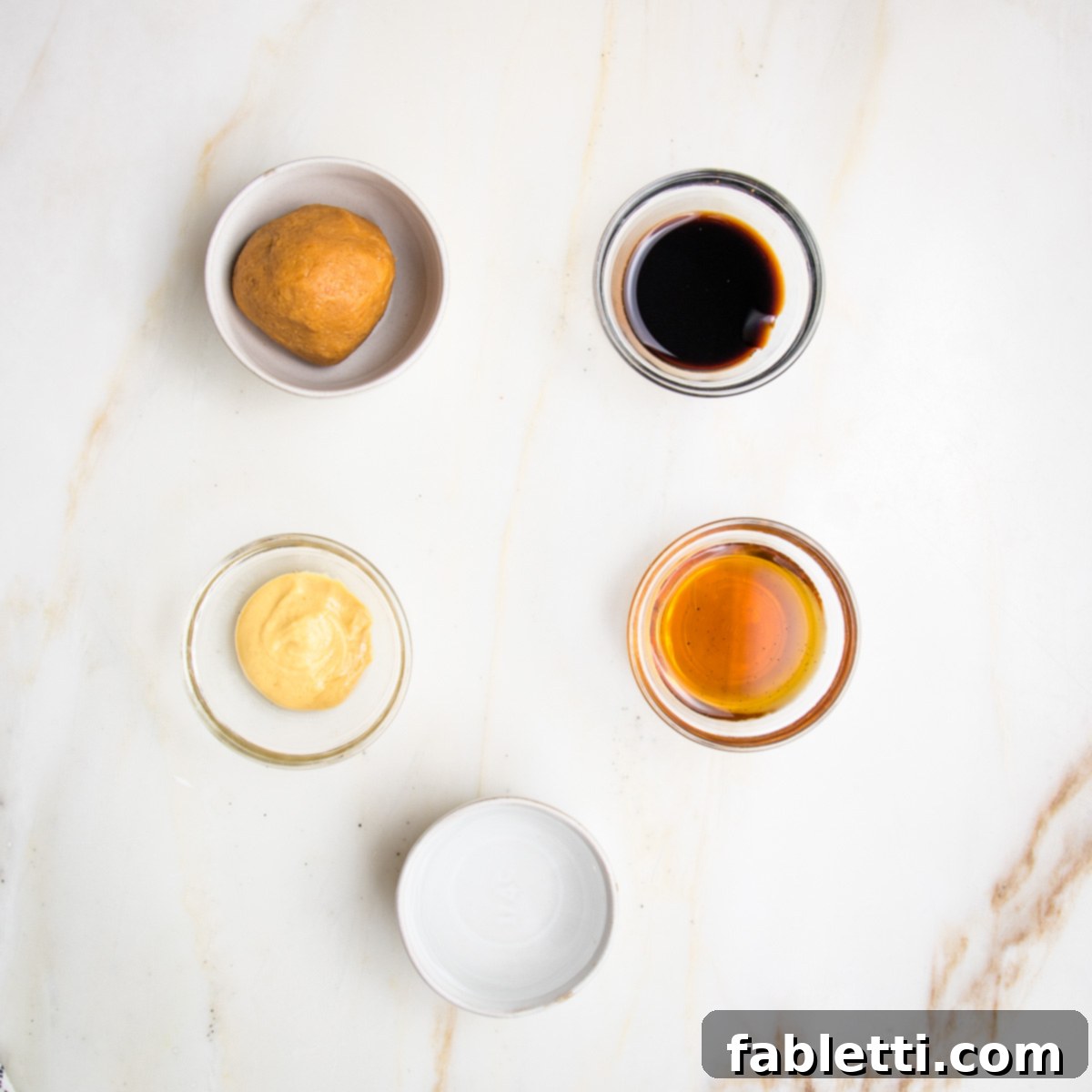 Rustic Tuscan Chopped Kale Medley 8 Small bowls filled with light miso, balsamic vinegar, dijon mustard, maple syrup and water.