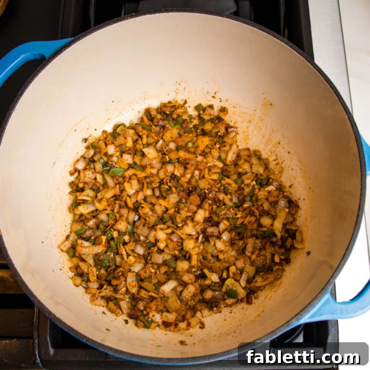 Hearty Vegan Taco Soup with Crispy Tortilla Strips 12 sauteed onions, garlic, jalapenos and taco seasonings.