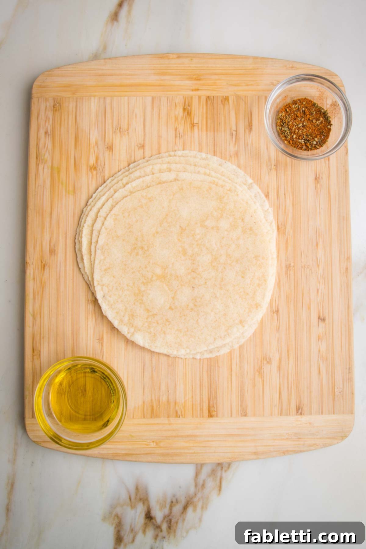 Hearty Vegan Taco Soup with Crispy Tortilla Strips 5 Ingredients for baked tortillas strips to go into taco soup. Tortillas, olive oil and taco seasonings.
