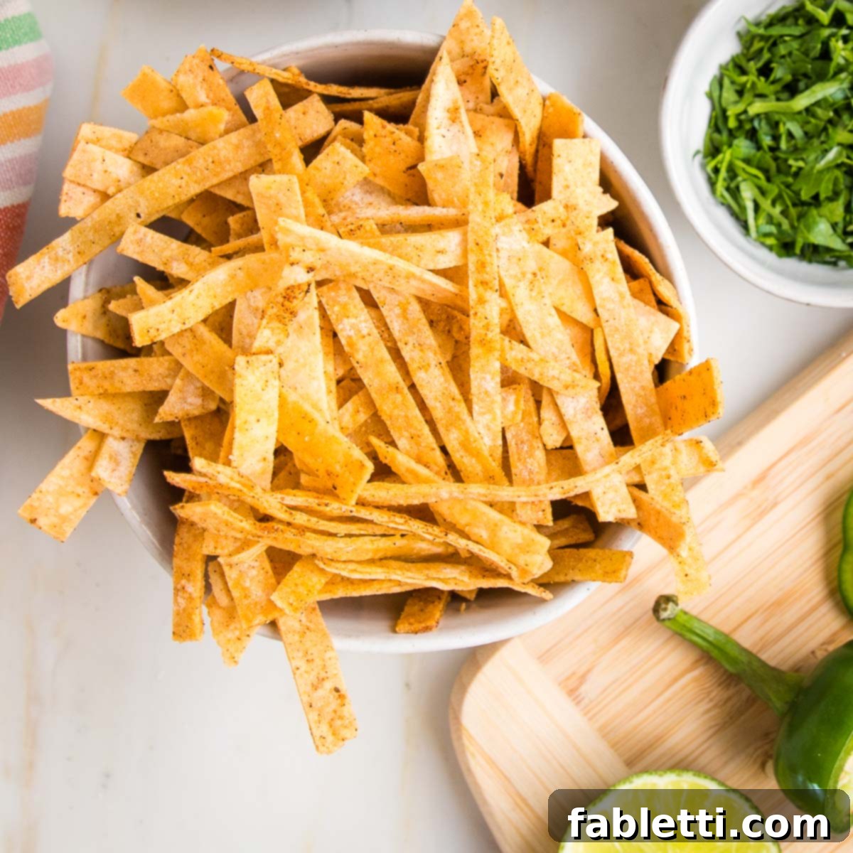 Hearty Vegan Taco Soup with Crispy Tortilla Strips 10 small bowl filled with baked tortilla strips