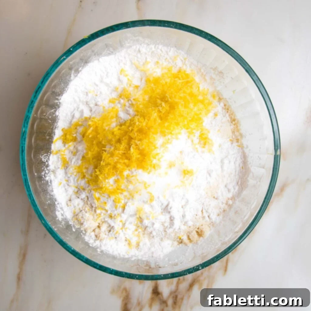 Dry ingredients for olive oil cake: almond flour, arrowroot powder and lemon zest.