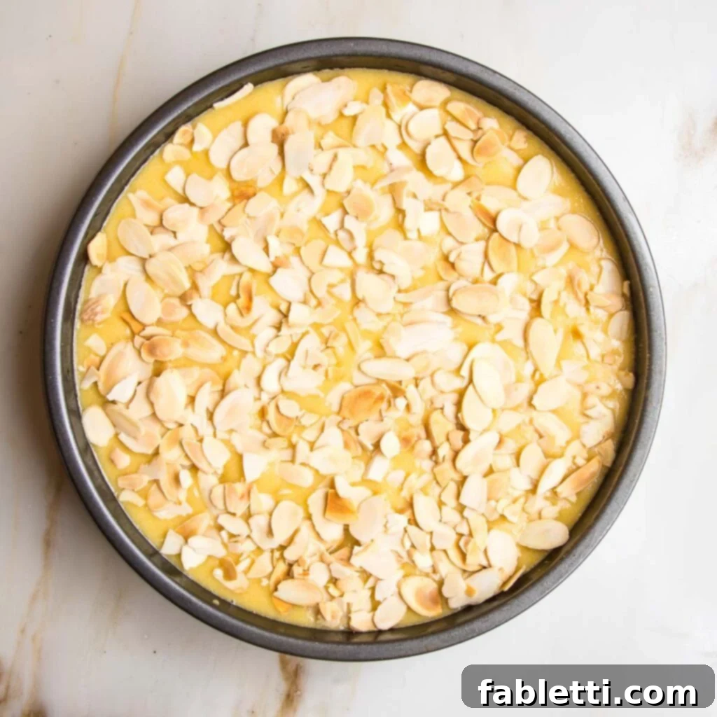 Cake batter in pan, ready for almonds.