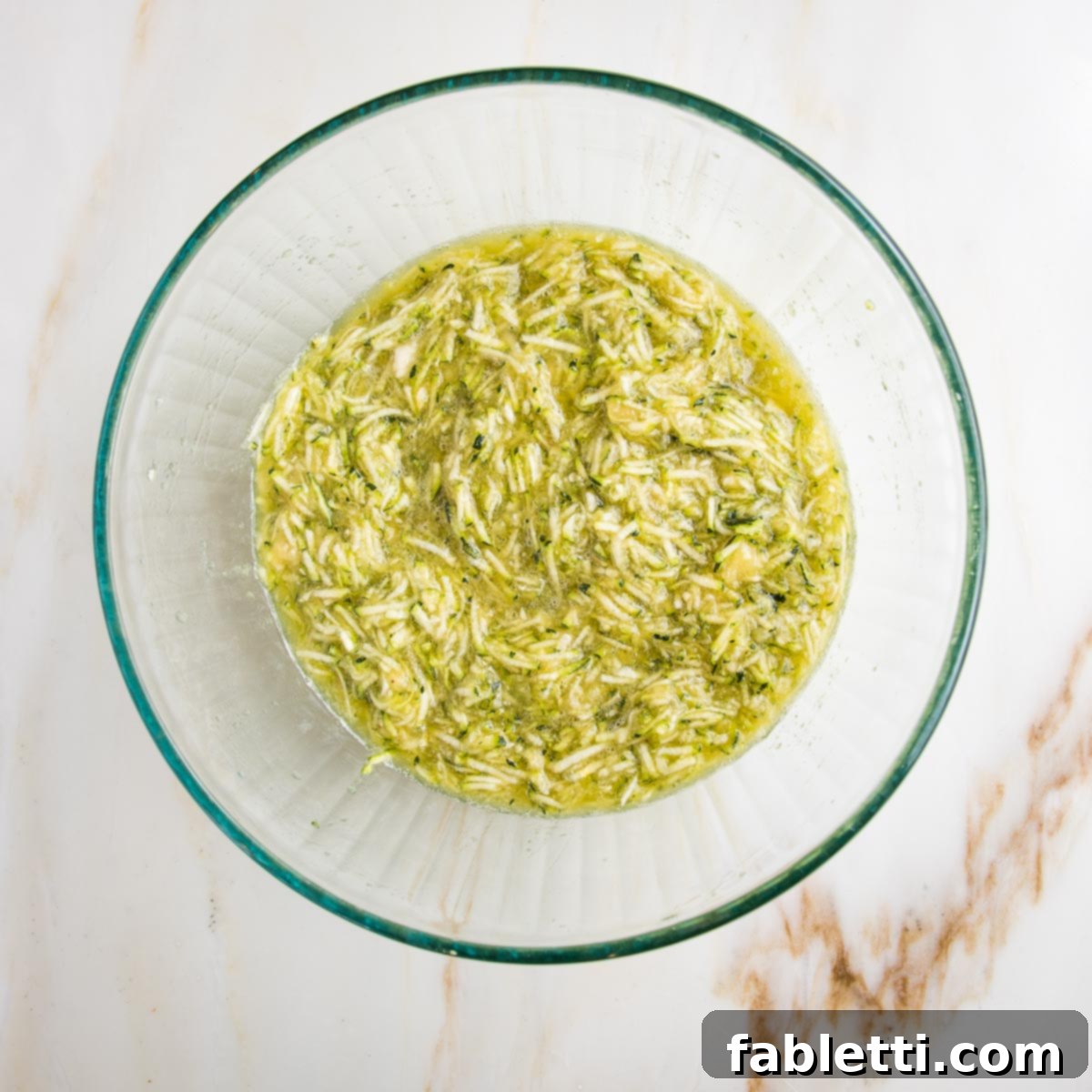 Garden Fresh Vegan Zucchini Muffins 6 Mixed up wet ingredients for muffins, including shredded zucchini.