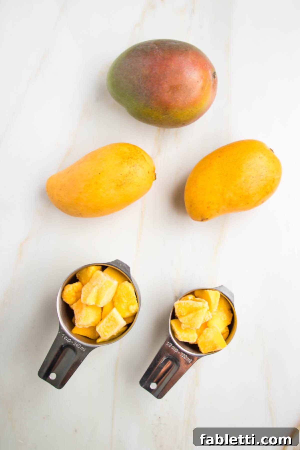 Tropical Mango Vinaigrette 4 Examples of mango needed for salad dressing: one large red mango or 2 smaller ataulfo mangos, or 1 ½ cups frozen mango cubes.