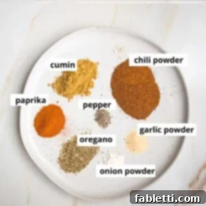 Salt-Free Homemade Taco Seasoning 7 Taco seasoning ingredients labeled: chili powder, cumin, paprika, pepper, oregano, garlic powder, onion powder.