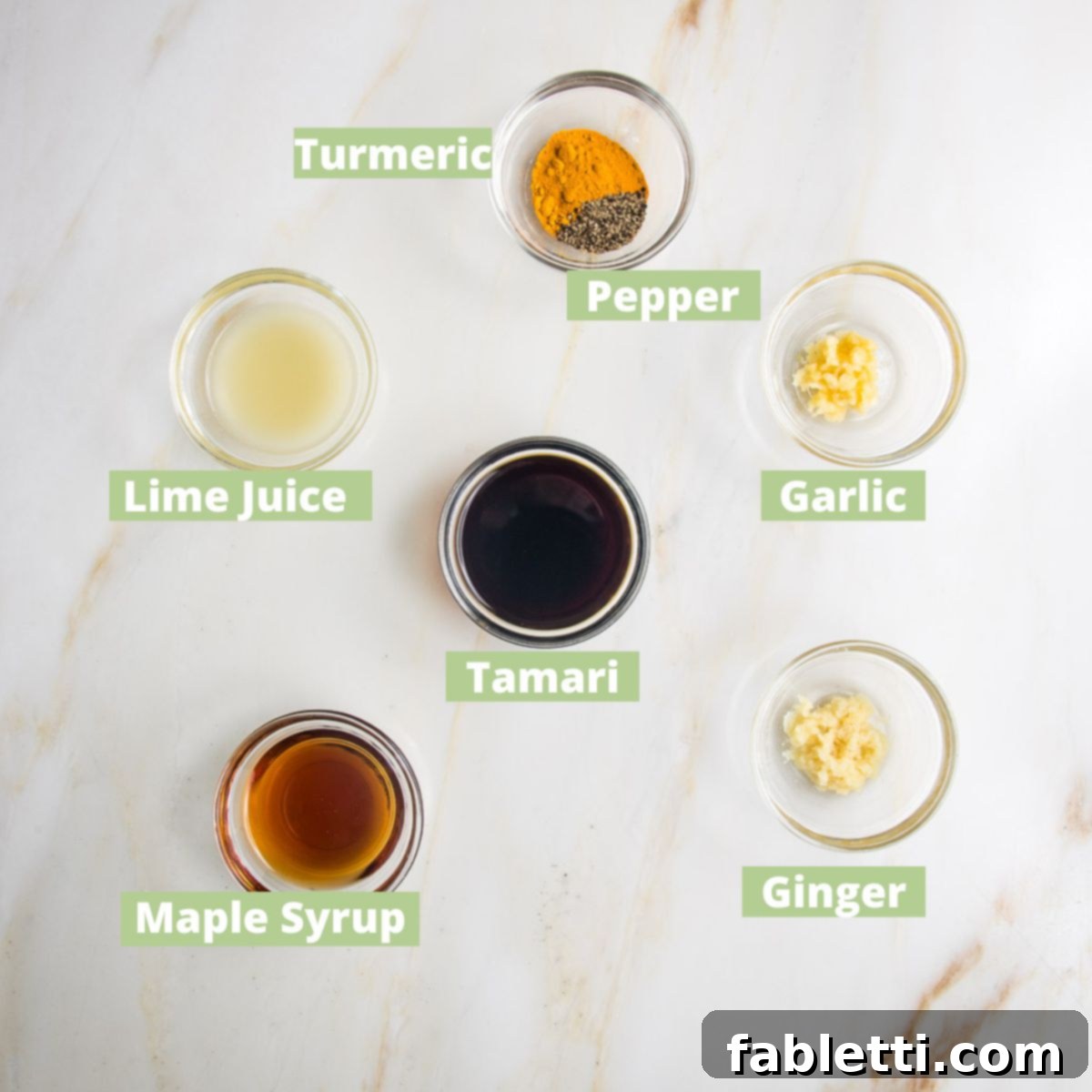 Grilled Tofu Satay with Creamy Peanut Sauce 4 Tofu Satay Marinade ingredients labeled: turmeric, pepper, garlic, ginger, lime juice, tamari, maple syrup.