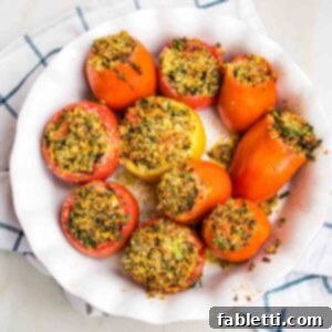 Plant-Powered Stuffed Tomatoes 17 Round baking dish filled with baked stuffed tomatoes, garnished with fresh herbs.