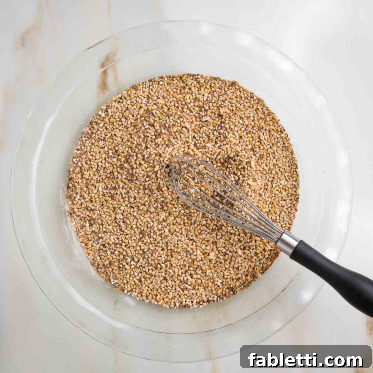Hearty Baked Steel-Cut Oats 6 Glass pie plate filled with mixture of steel cut oats, flax, and chia.