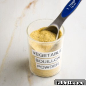 Garden Gold Broth Mix 10 Vegetable Bouillon Powder labeled jar with yellow powdery mix inside plus a Tablespoon measure.
