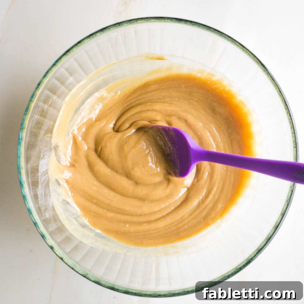 Chewy Vegan Gluten-Free Tahini Chocolate Chip Cookies 6 Wet ingredients for cookies mixed together in a glass bowl.