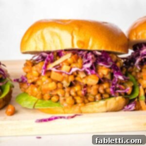 Sloppy joe in a burger bun with purple cabbage.