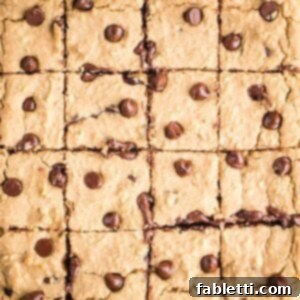 Bean-Powered Vegan Blondies 15 Rows of square cut blondies with chocolate chips.