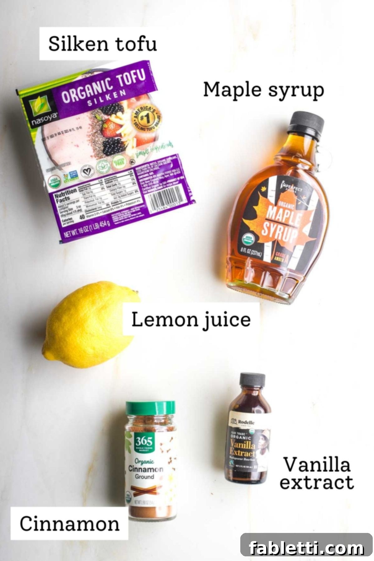 Velvety Vegan Fruit Dip 4 Labeled ingredients: silken tofu, maple syrup, lemon, cinnamon and vanilla extract.