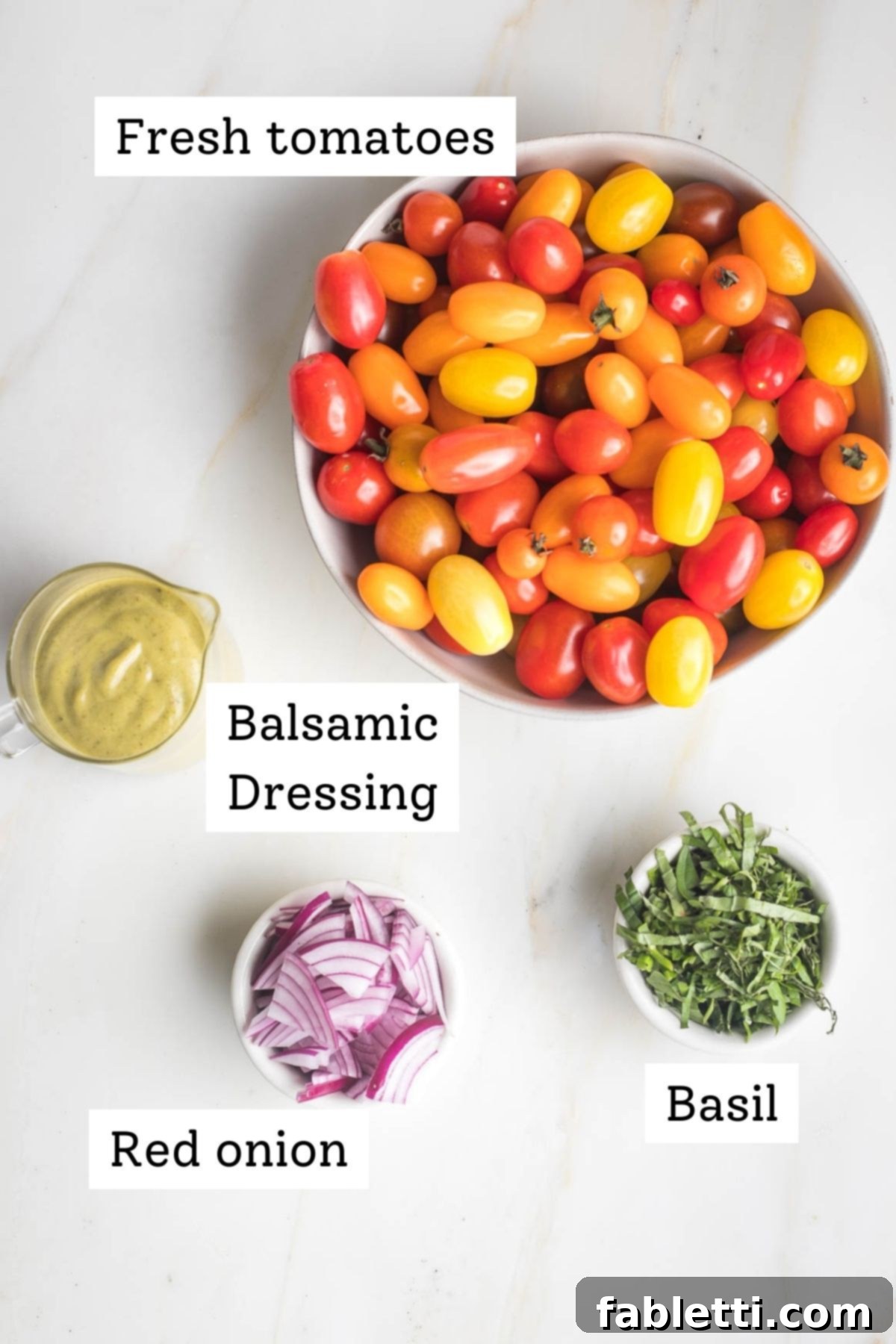 Sun-Kissed Tomato and Onion Salad with Balsamic Drizzle 3 Bowls of small tomatoes, julienned basil leaves, sliced red onion and a pitcher of creamy balsamic dressing.