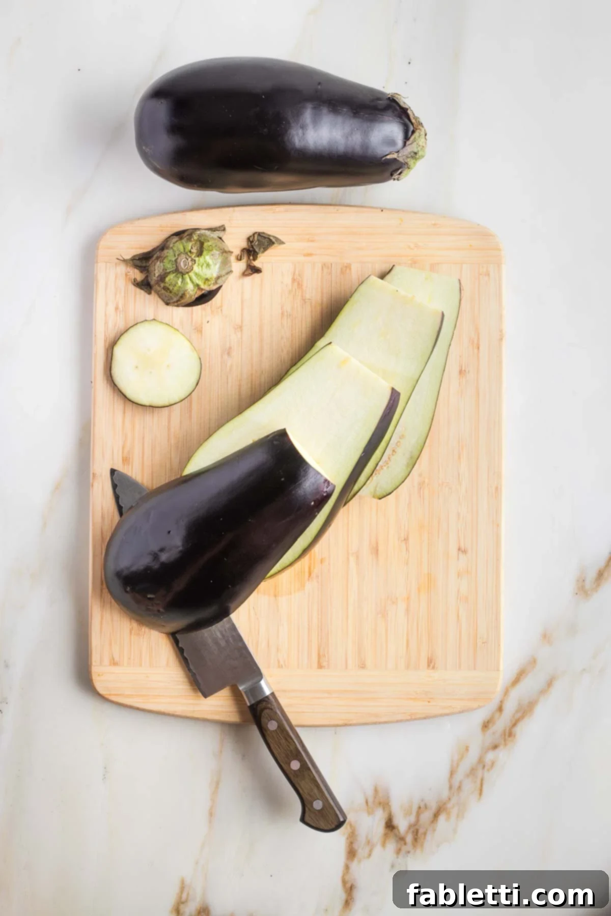 Savory Sautéed Eggplant Salad 4 Top and tail of eggplant cut off, then making ½-inch vertical cuts.