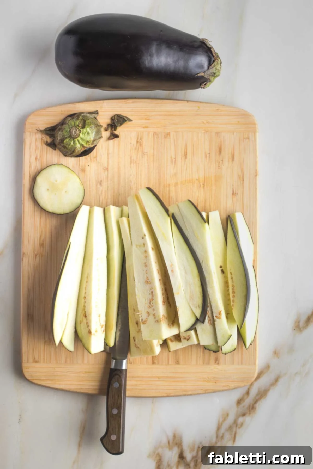 Savory Sautéed Eggplant Salad 5 Eggplant slices now cut into long, ½-inch thick vertical strips.