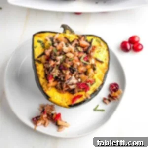 Acorn squash half, filled with wild rice and cranberry stuffing.