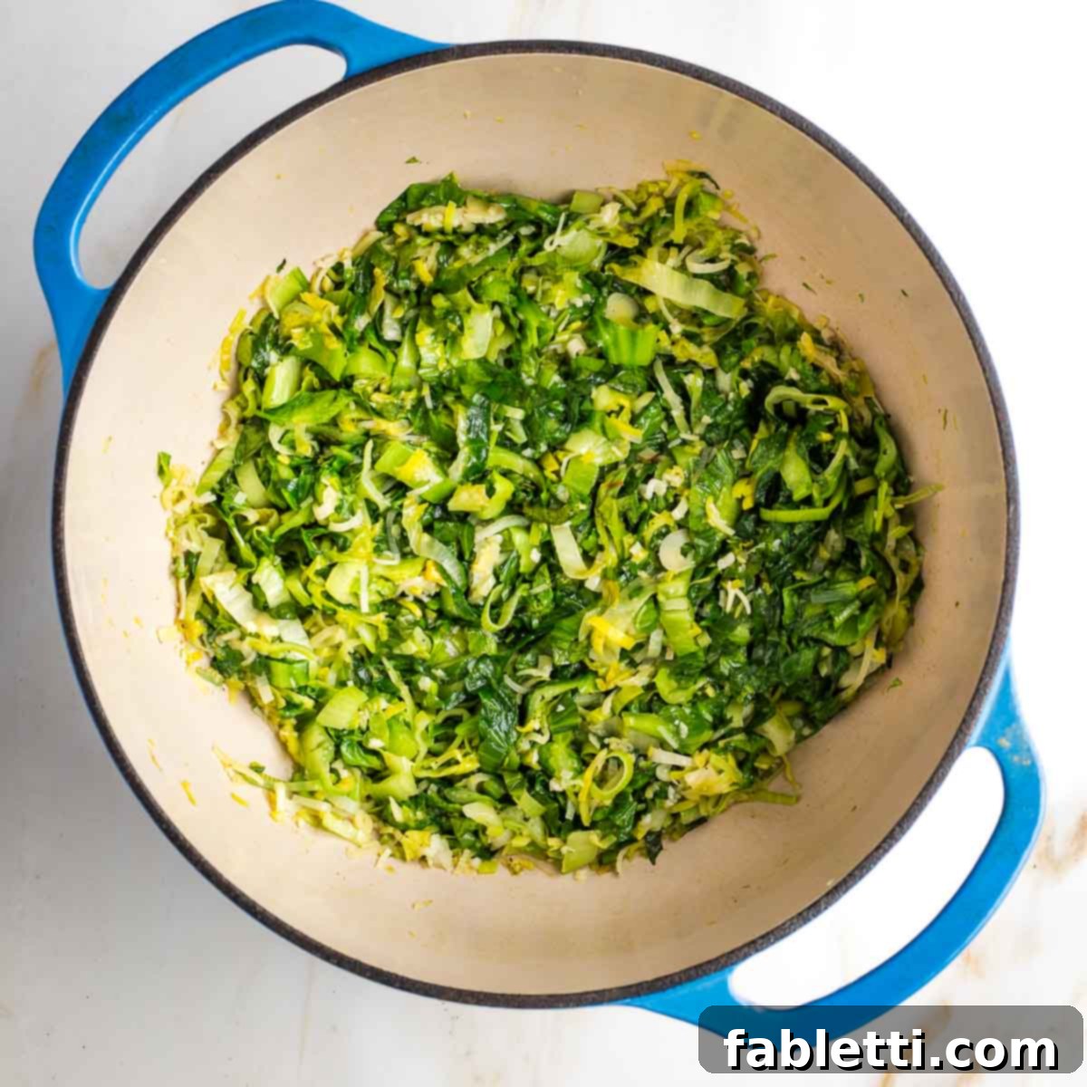 Wilted greens at the bottom of a dutch oven.