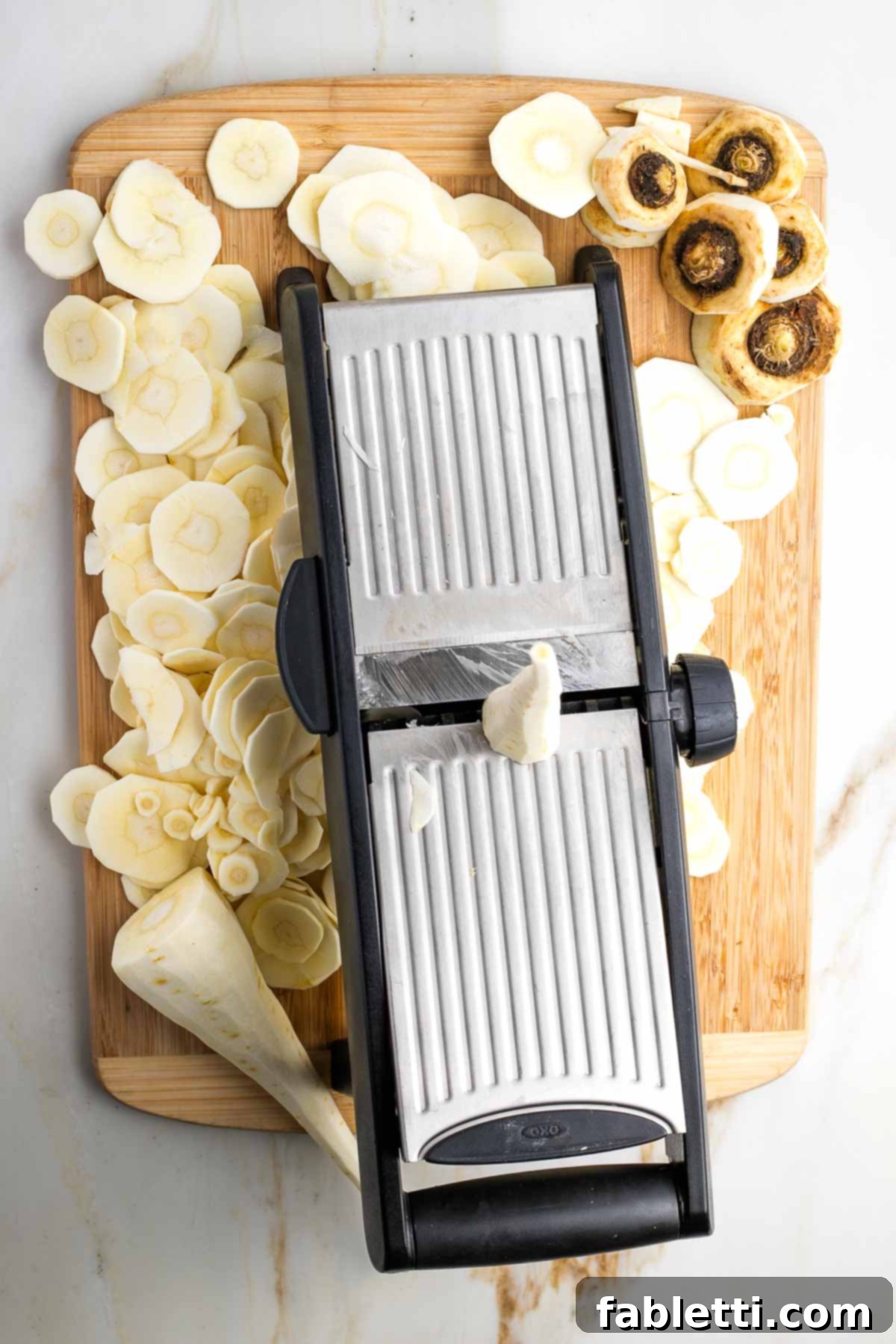 Luscious Vegan Parsnip Gratin 14 Mandolin, thinly slicing parsnips.