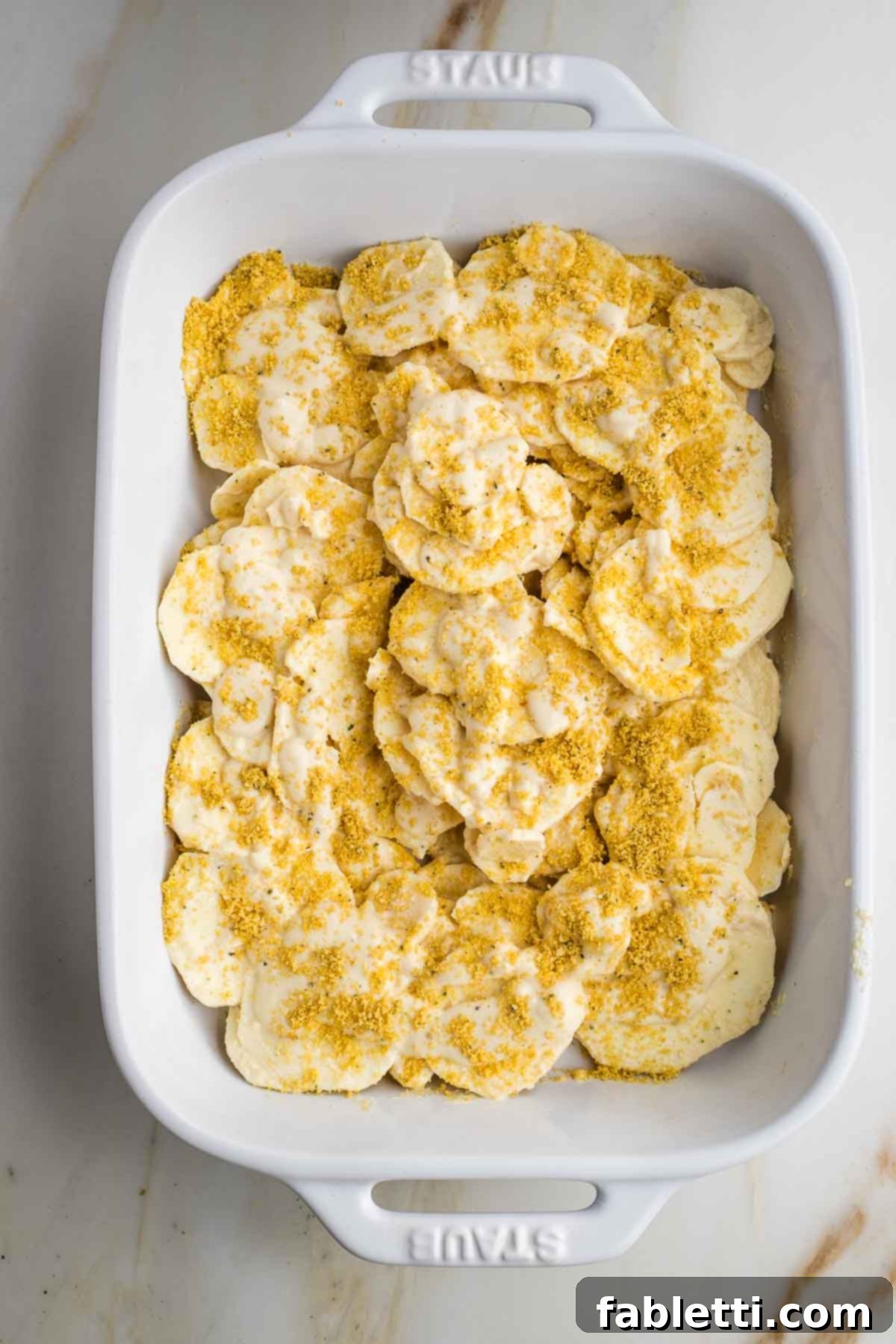 Luscious Vegan Parsnip Gratin 18 Layers of sliced parsnips sprinkled with vegan parmesan cheese.