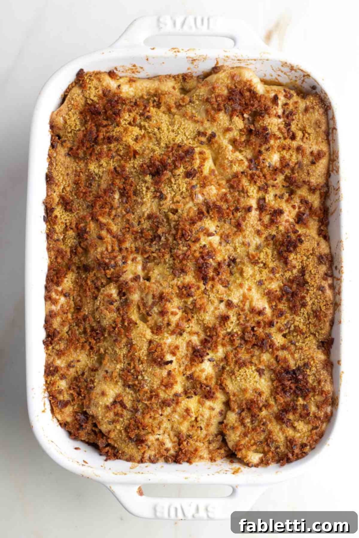 Luscious Vegan Parsnip Gratin 22 Baked parsnip gratin in a casserole dish.