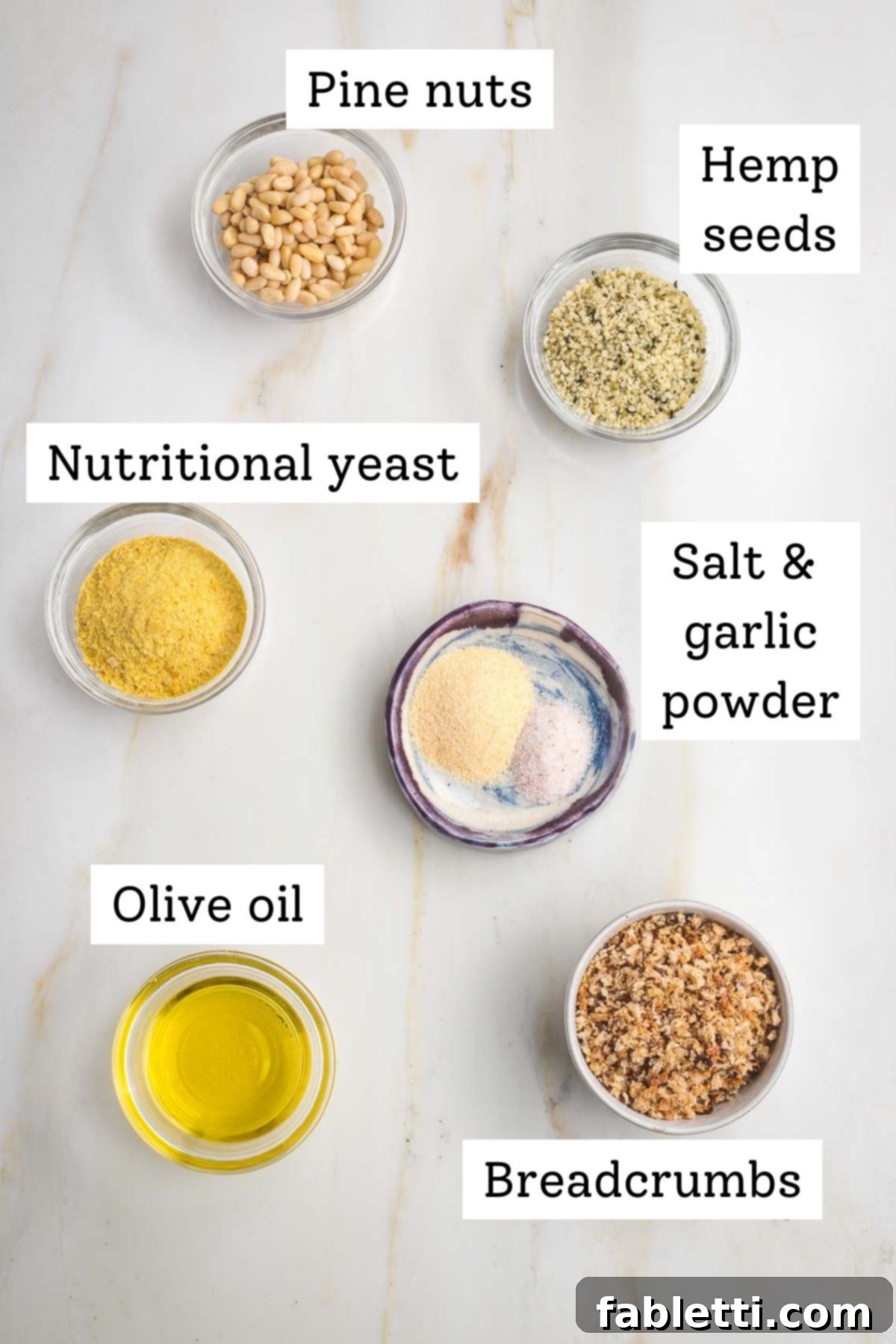 Luscious Vegan Parsnip Gratin 5 Labeled ingredients: pine nuts, hemp seeds, nutritional yeast, garlic powder, olive oil, breadcrumbs.