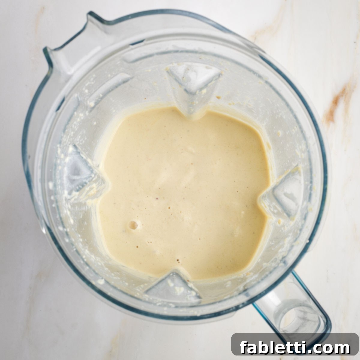 Luscious Vegan Parsnip Gratin 9 Beige, creamy sauce in a blender.