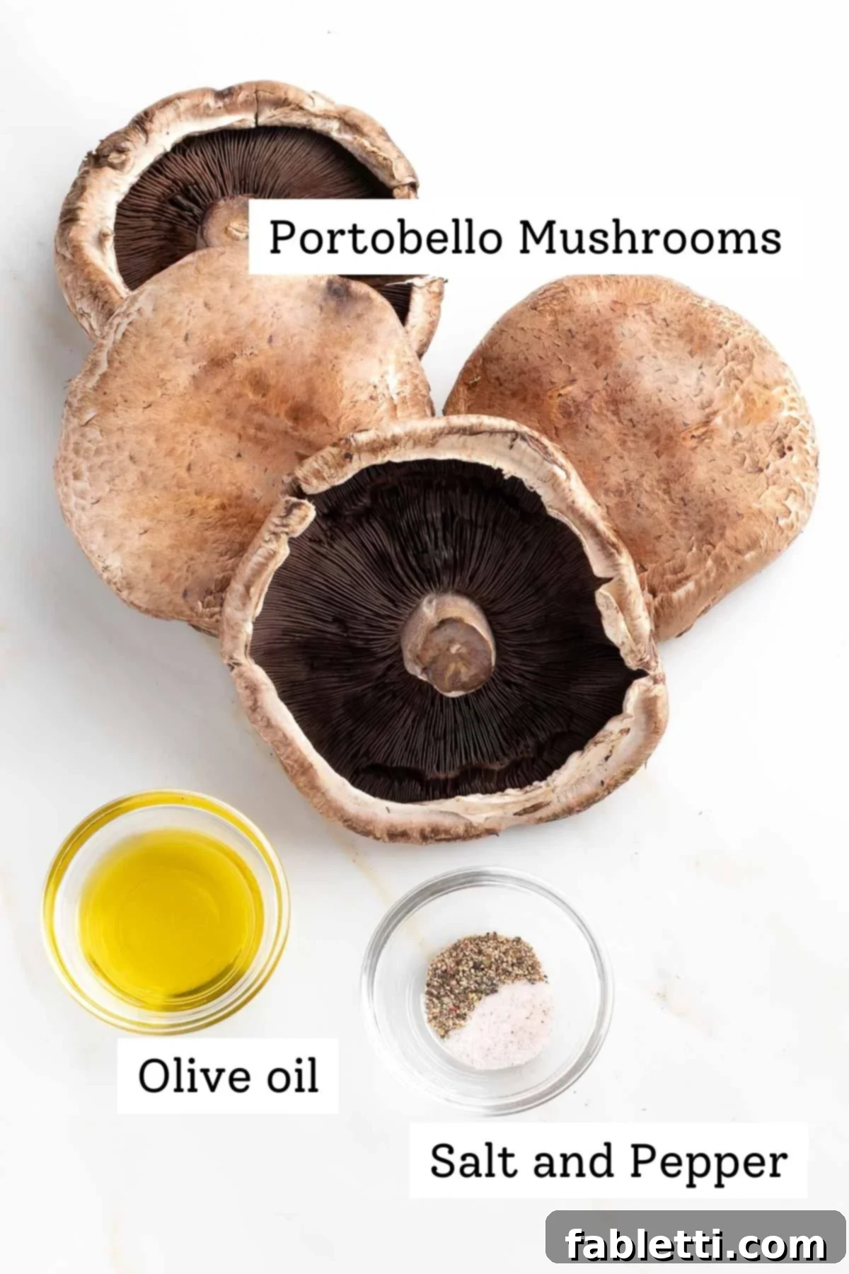 Gourmet Vegan Stuffed Portobello Mushrooms 3 Large portobello mushroom caps, a small dish of olive oil, and some salt and pepper, ready for preparation.