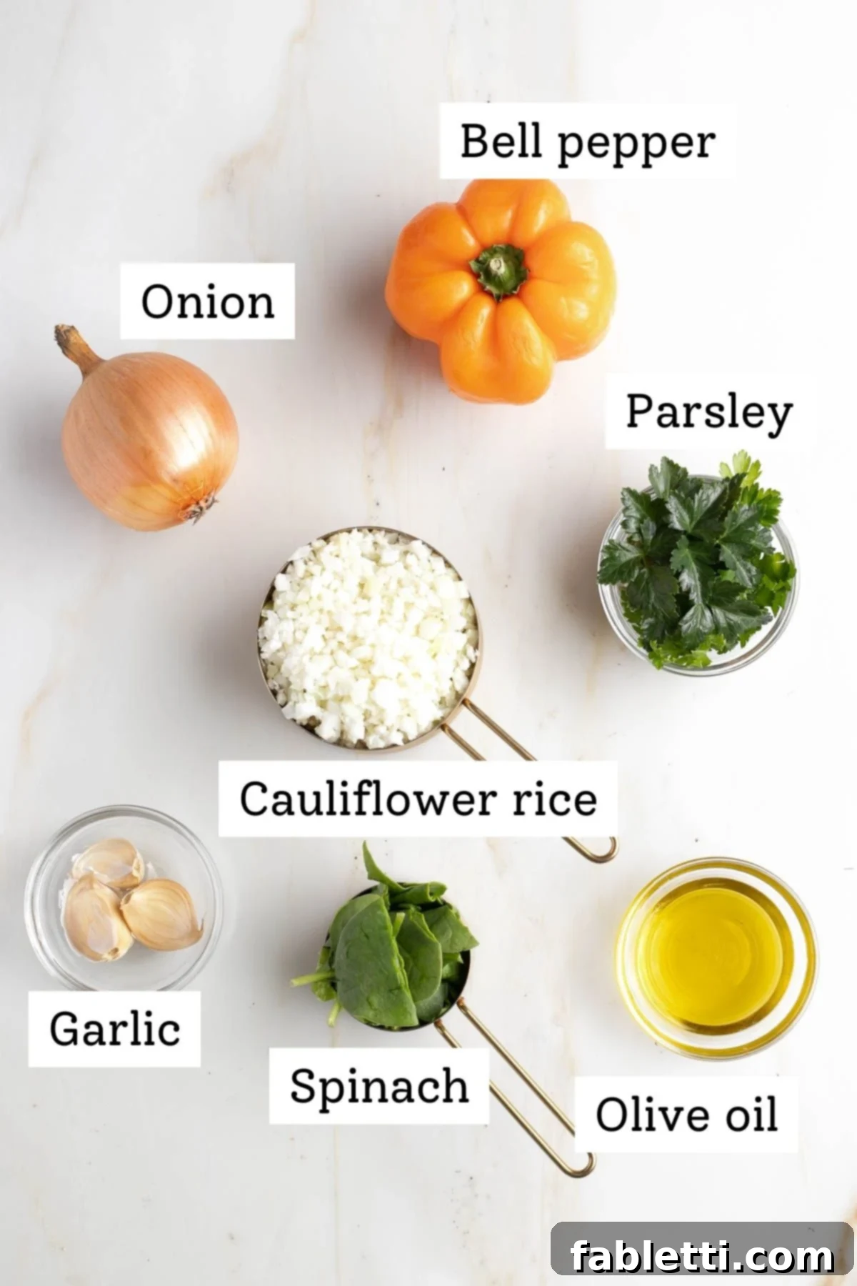 Gourmet Vegan Stuffed Portobello Mushrooms 4 Labeled ingredients for the stuffing: bell pepper, onion, cauliflower rice, parsley, garlic, spinach, and olive oil, neatly arranged.