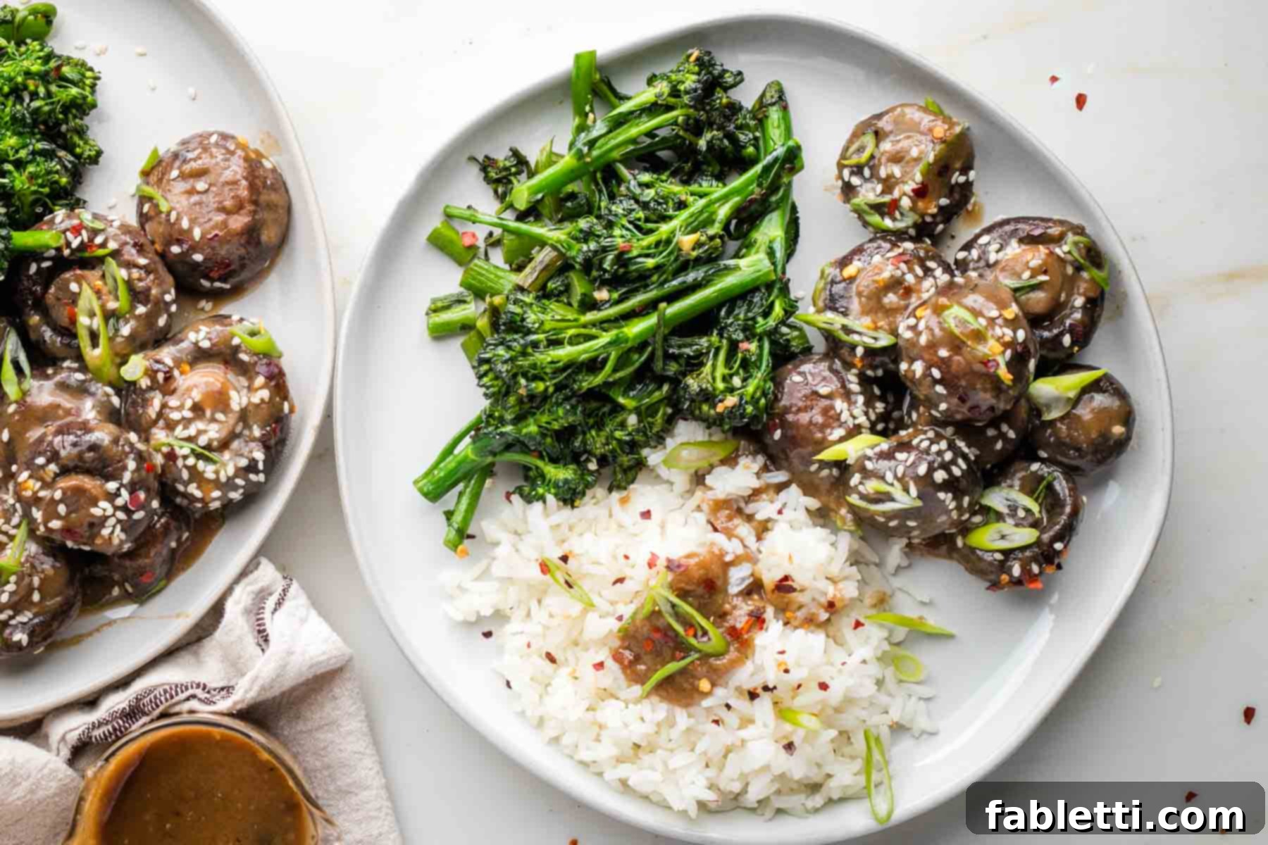 Umami-Rich Vegan Miso Mushrooms 14 A cutting board with fresh herbs and spices, alongside a small bowl of miso sauce.