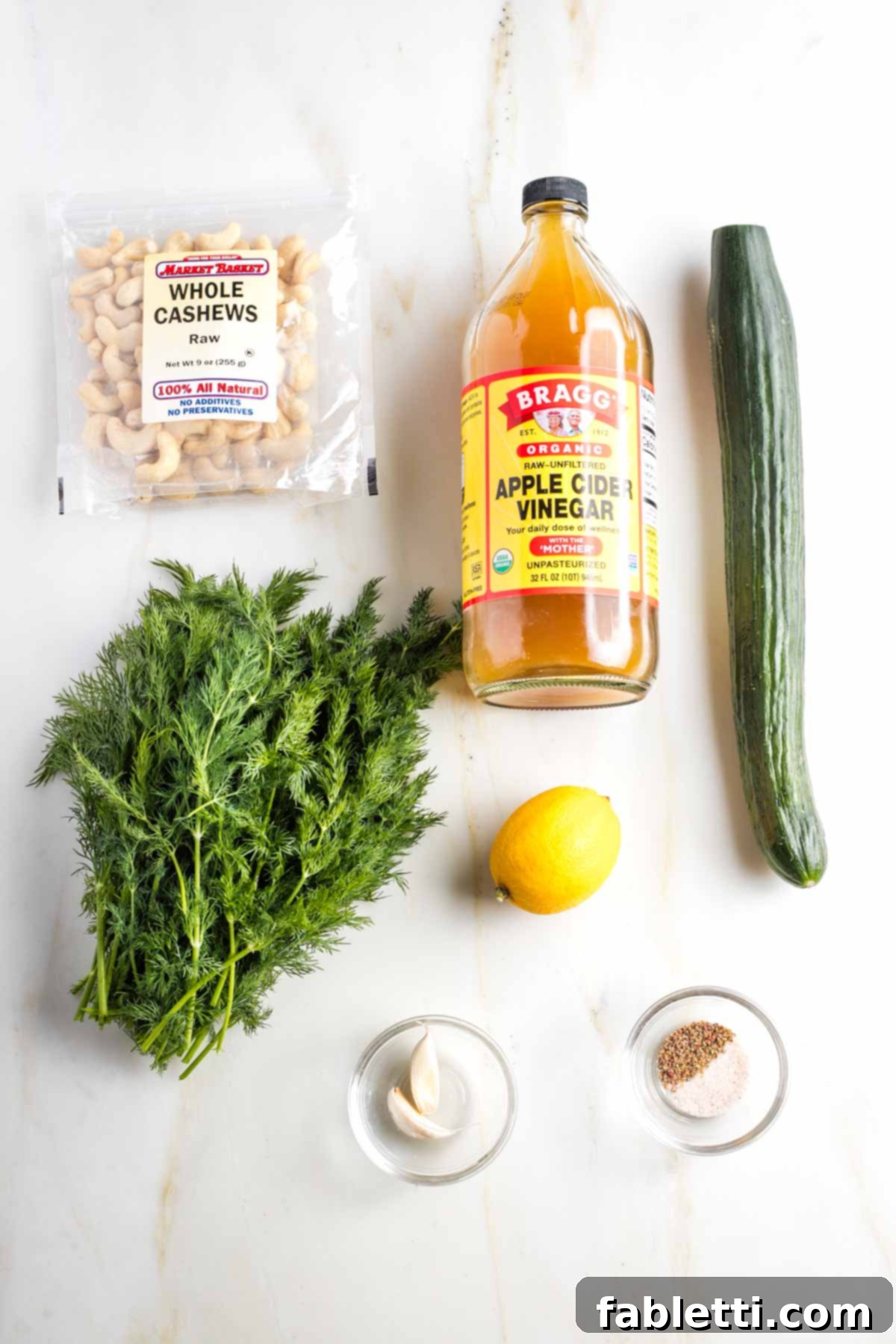 Vegan Tzatziki Sauce 3 Ingredients for Tzatziki: cashews, apple cider vinegar, cucumber, fresh dill, lemon, garlic cloves, salt and pepper.