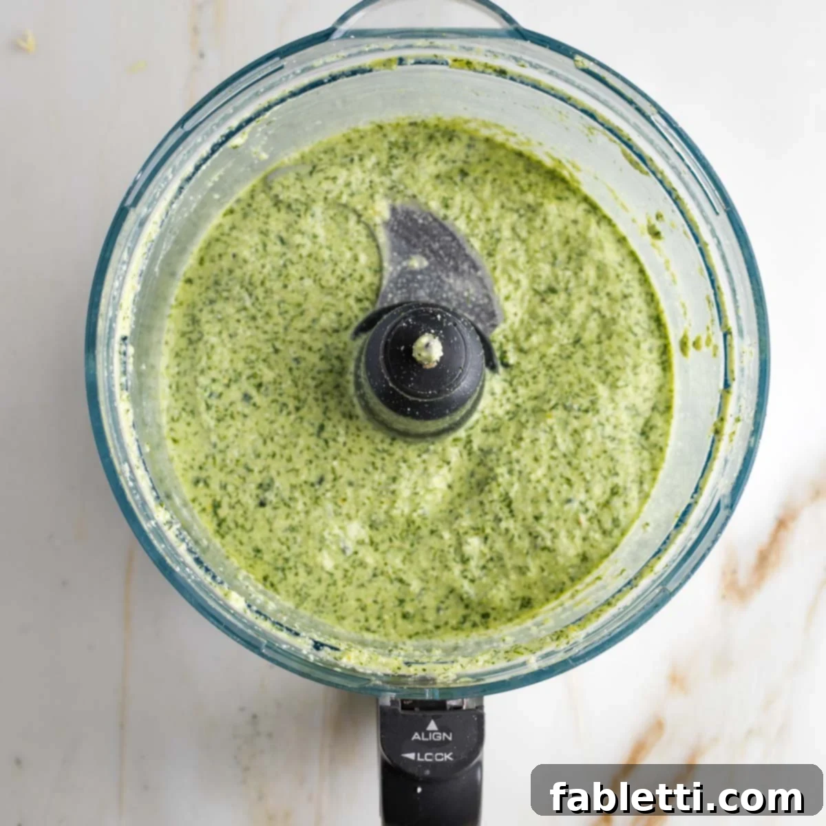 Vegan Tzatziki Sauce 8 Food processor bowl with green creamy vegan tzatziki sauce.