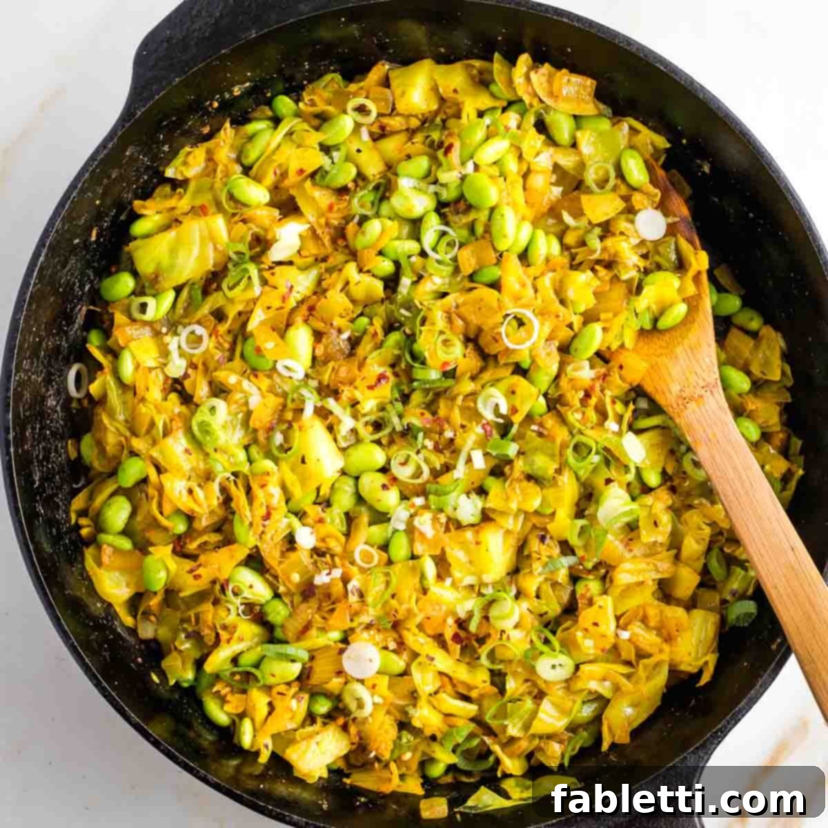 Speedy Skillet Curried Cabbage 9 Finished cabbage curry garnished with sliced scallions and red pepper flakes.