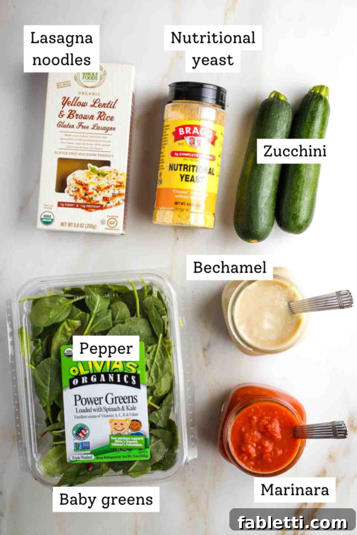 Lush Layers: Gluten-Free Vegan Garden Lasagna 5 Labeled ingredients: lasagna noodles, nutritional yeast, zucchini, greens, bechamel, and marinara.