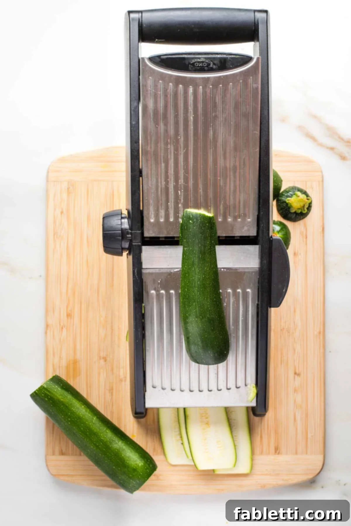 Lush Layers: Gluten-Free Vegan Garden Lasagna 6 Mandolin thinly slicing zucchini lengthwise.