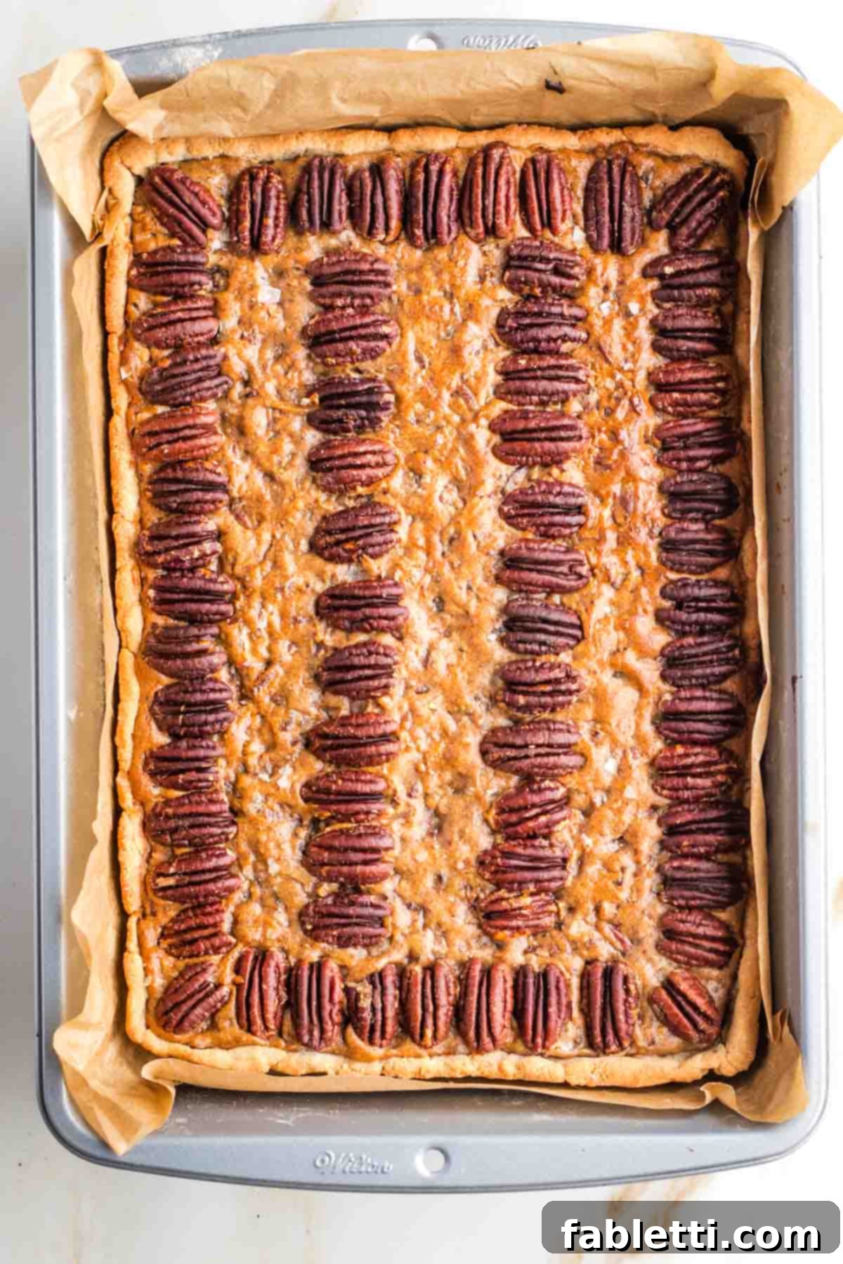 Naturally Sweetened Vegan Pecan Pie Bars 20 Rectangular pecan pie in a baking pan.