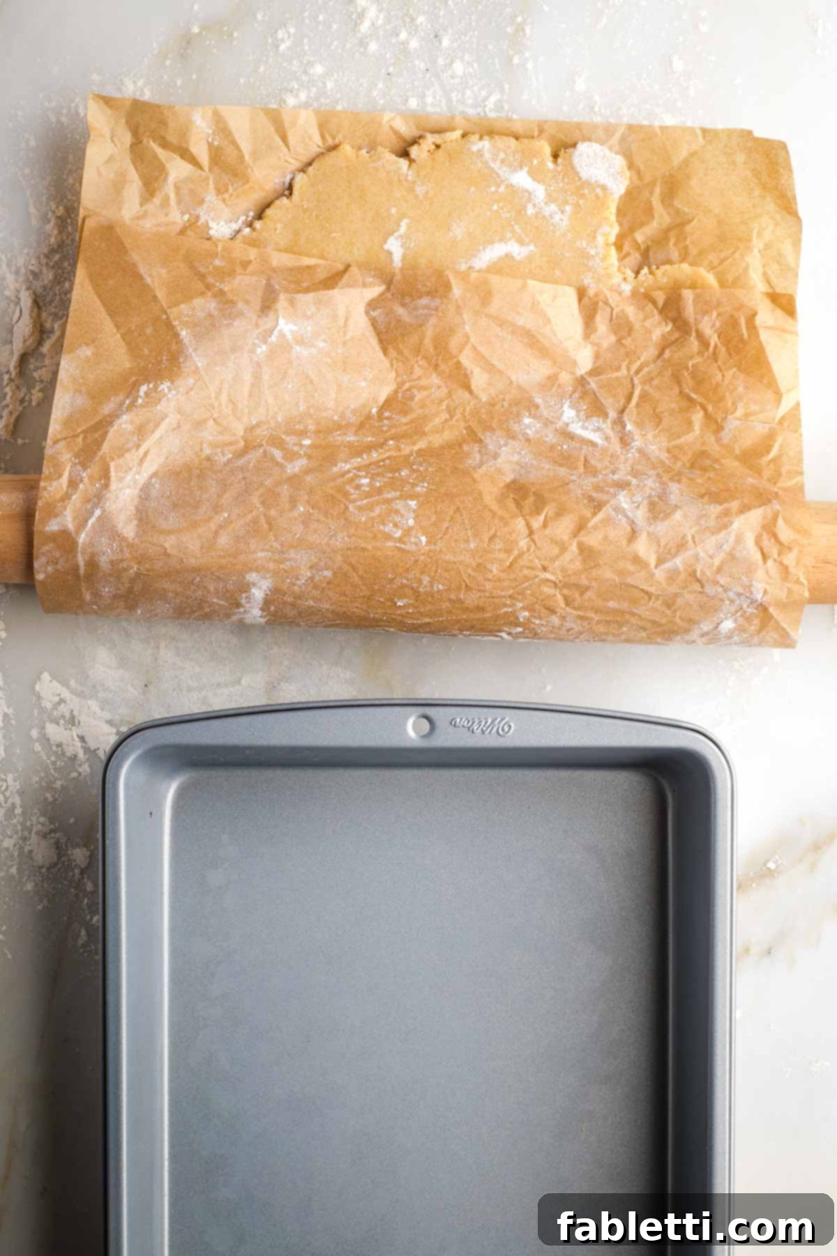 Naturally Sweetened Vegan Pecan Pie Bars 8 Pie crust on parchment paper, spread over rolling pin to help transfer it to baking dish.