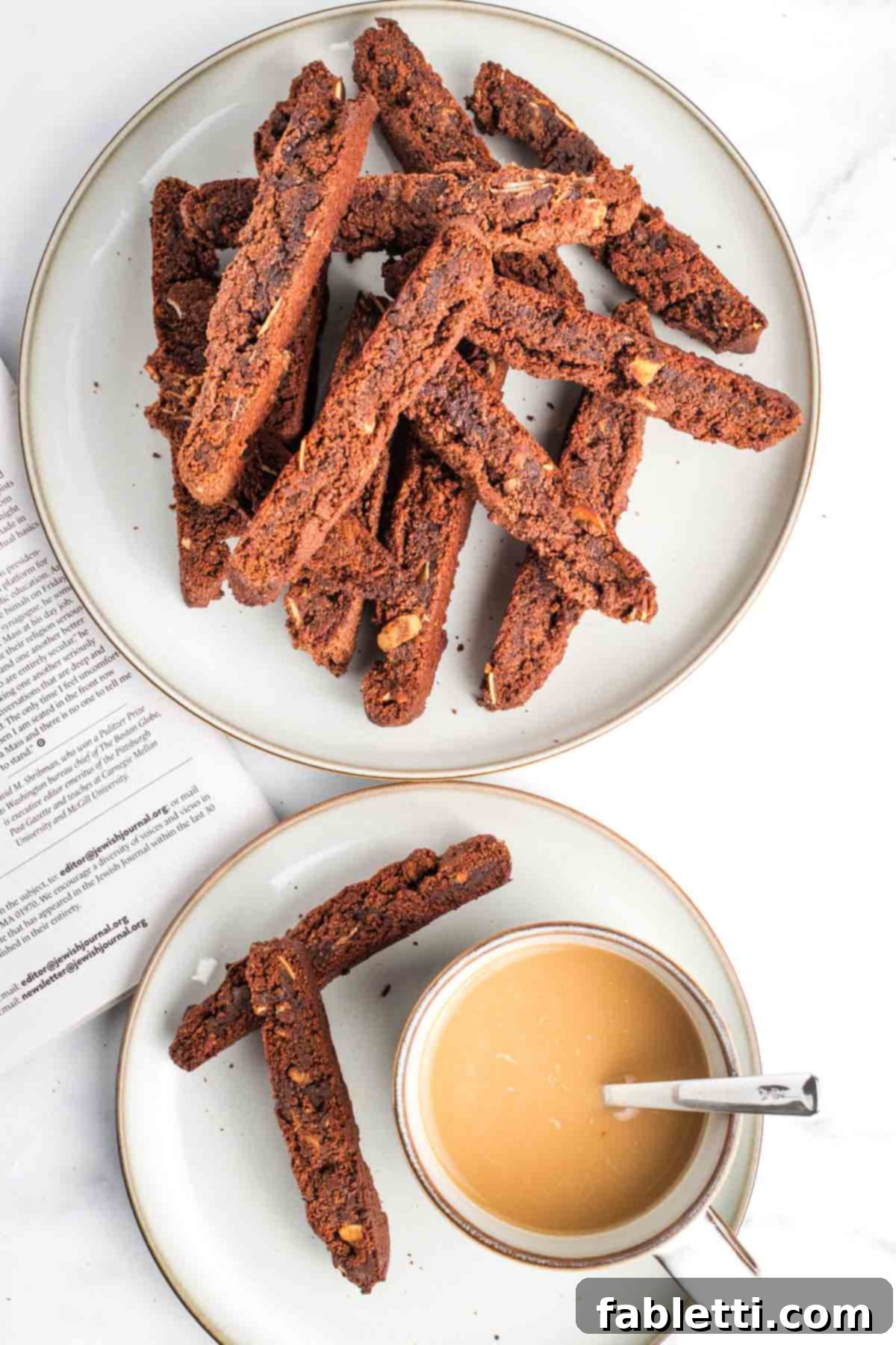 Irresistible Vegan Gluten-Free Chocolate Almond Biscotti 2 Plate piled with chocolate biscotti and a small plate with 2 biscotti and a cup of coffe